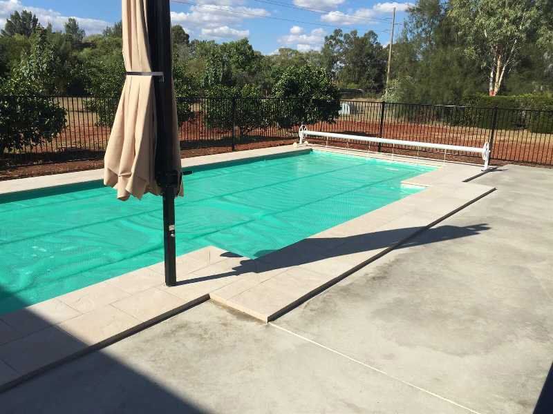Swimming Pool And Umbrella — Pool and Landscaping in Dubbo, NSW