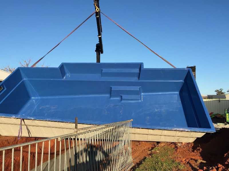 Pool Shell Being Lowered by Crane — Pool and Landscaping in Dubbo, NSW