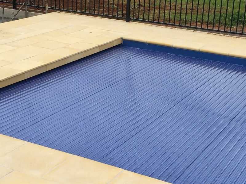 Tiled Pool With Pool Cover— Pool and Landscaping in Dubbo, NSW