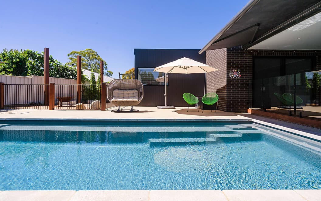 Swimming Pool Area with Outdoor Furniture — Inground Pools in Dubbo NSW