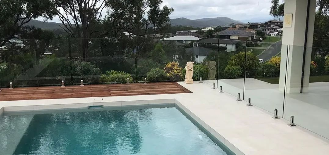 Glass pool fencing around outdoor entertaining area