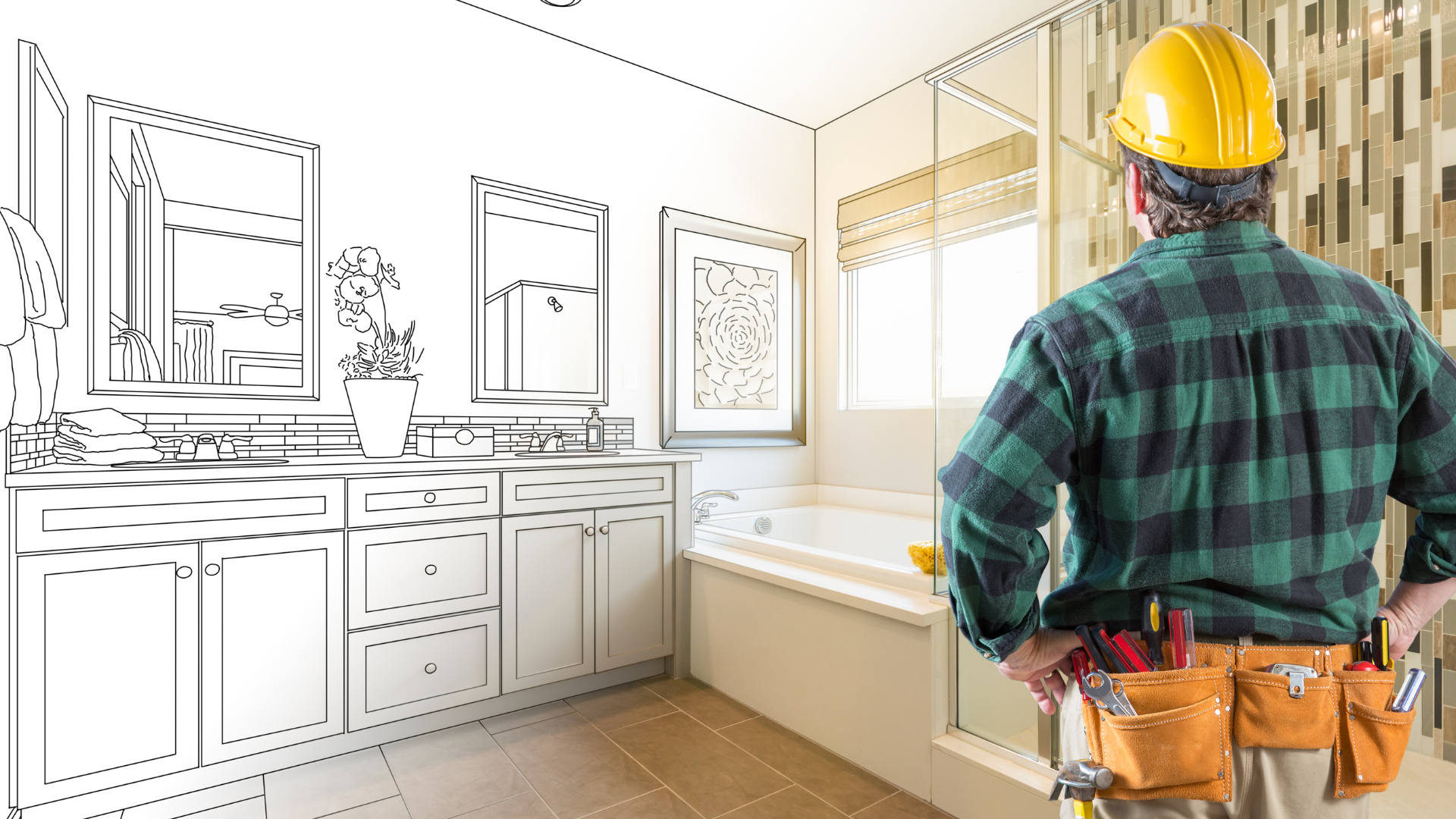 A contractor in a yellow hard hat and tool belt stands looking at a bathroom layout blending a sketch with a real space.