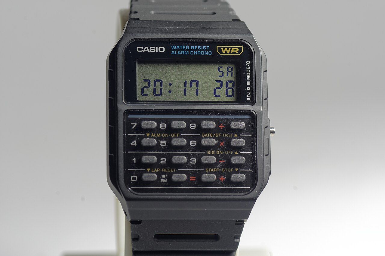 A Casio CA-53W calculator watch, with its 24-key calculator keypad below the LCD; the model has been in production since 1988.