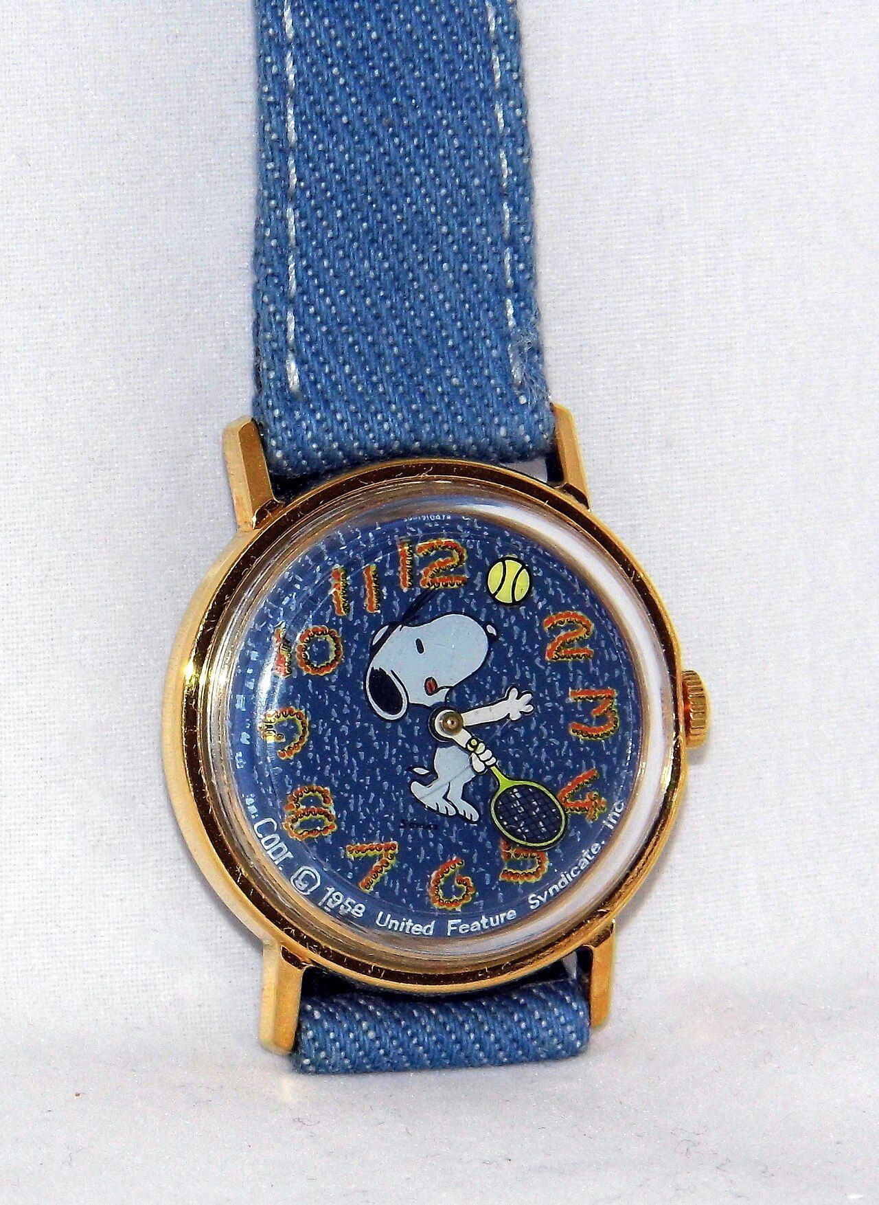 Vintage 1970s Timex Snoopy watch with Snoopy playing tennis on a denim dial