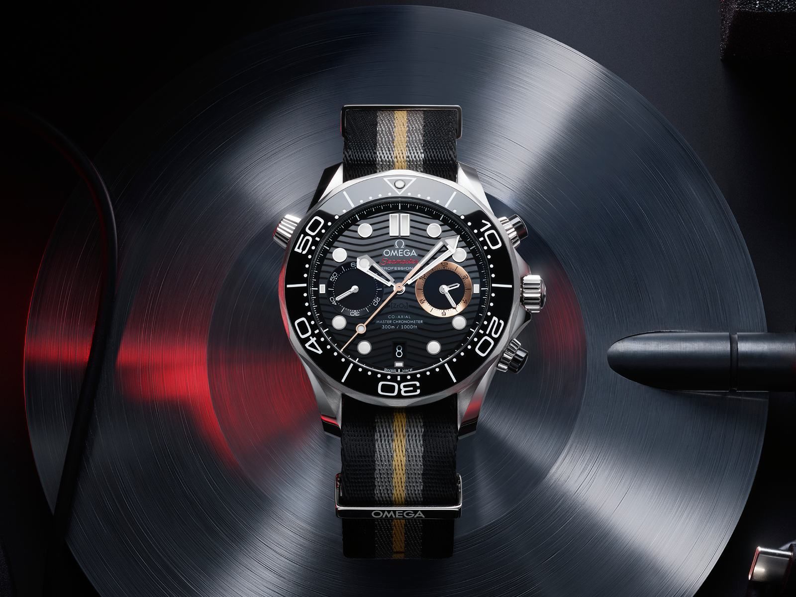 Omega Seamaster Diver 300M Chronograph 007 First Light with black ceramic bezel and laser-engraved wave dial