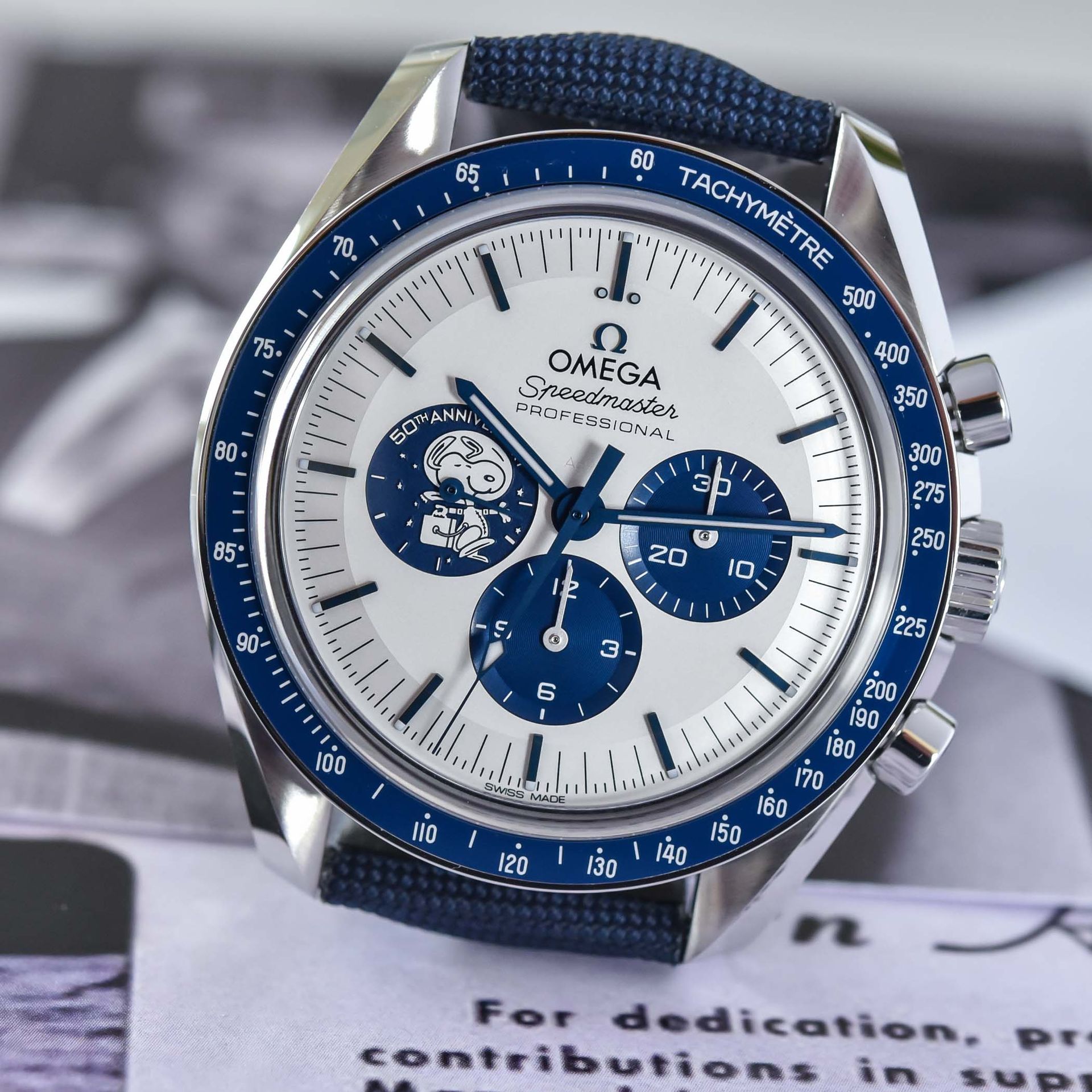 Omega Speedmaster Silver Snoopy Award 50th Anniversary with silver dial, blue subdials and blue ceramic bezel