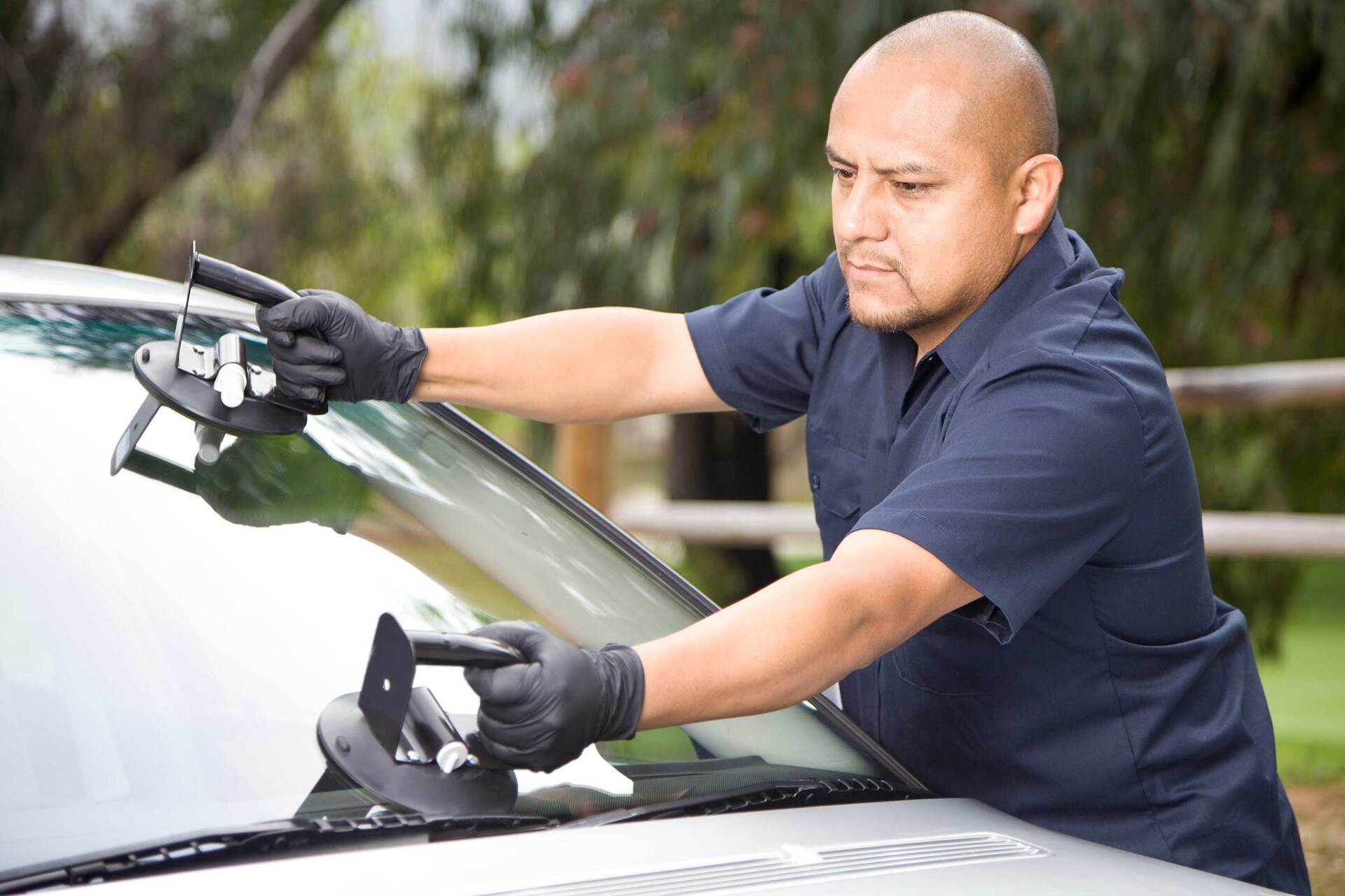 Man Replacing the Glass on a Car — Hutchinson, KS — Mobile Service Auto Glass