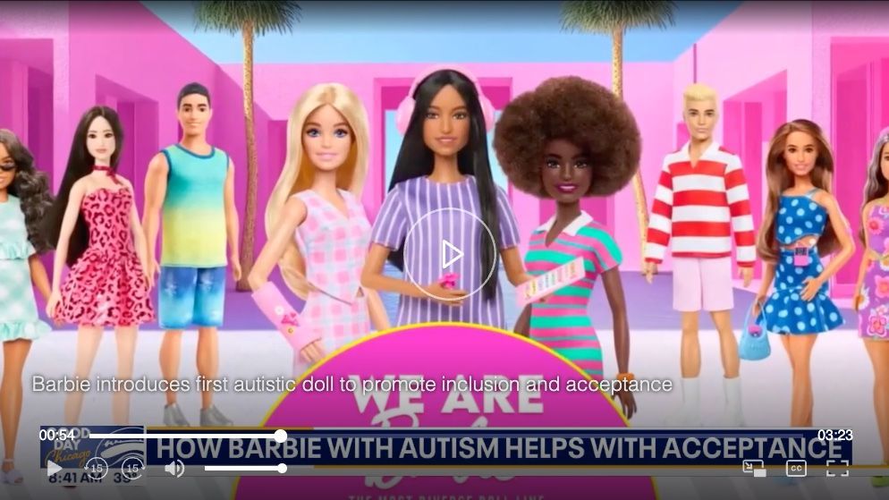 A diverse group of Barbie dolls stands in a pink setting with a video overlay about Barbie with autism and acceptance.