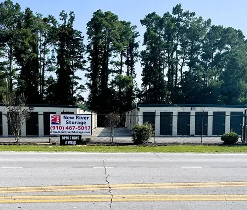 New River Storage facility in Newport NC with roadside sign and fenced drive-up storage units
