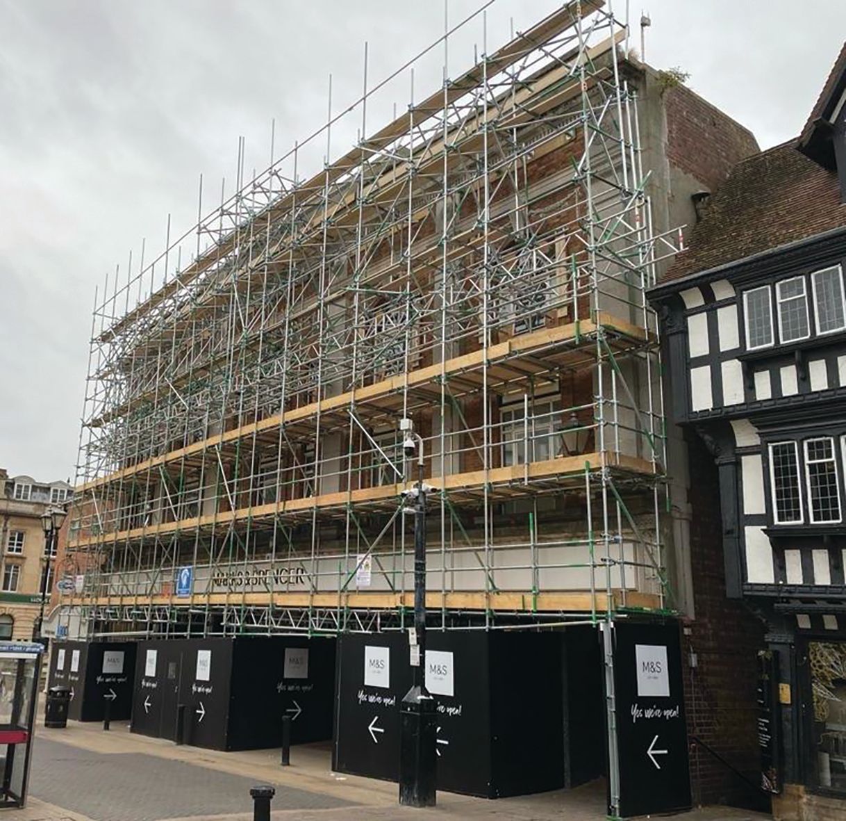 A large building is being built with scaffolding around it.