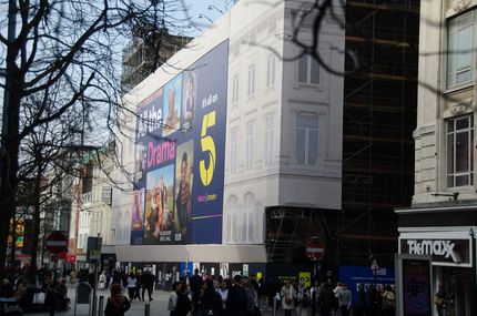 A large building is being built with scaffolding around it.