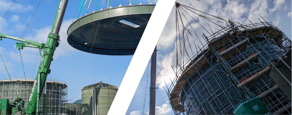 A crane is lifting a large object in the air next to a building under construction.