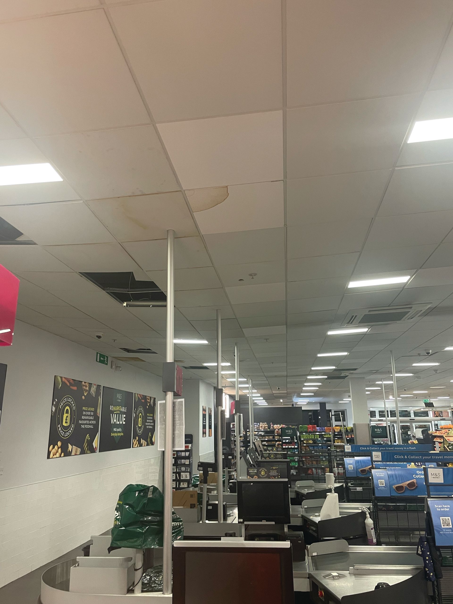 A large room with a ceiling that has a hole in it