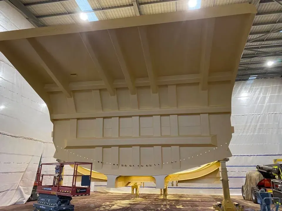 Large Beige Ship Structure Being Worked on in a Hangar — All Blast and Paint in Bakers Creek, QLD