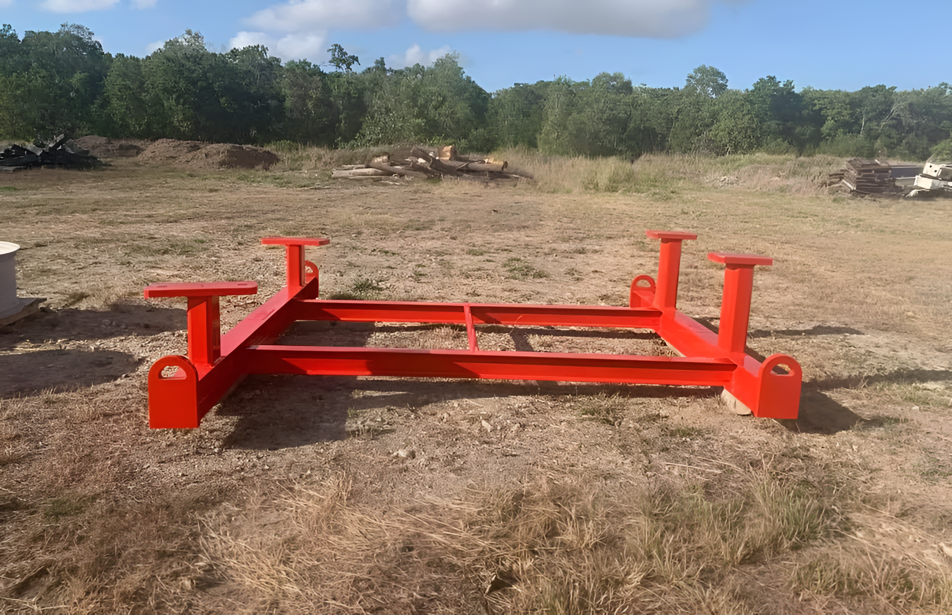 Red Metal Frame With Four Upright Posts, Outdoors on Dirt Ground — All Blast and Paint in Sarina, QLD