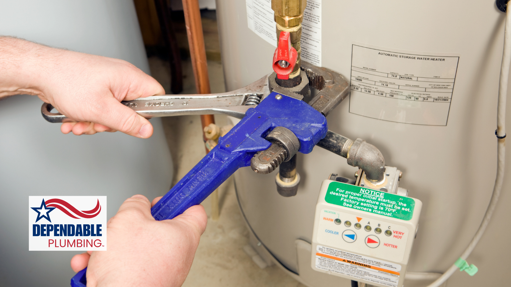 Plumber using a wrench on a water heater, indoors. Hands holding wrenches; silver and blue.