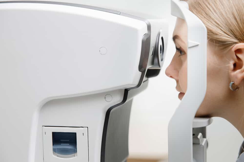 A Woman is Getting Her Eyes Checked by an Ophthalmologist — Eyepower In Buxton, NSW