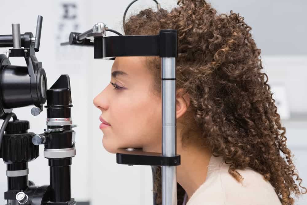 A Woman is Getting Her Eyes Examined by an Ophthalmologist — Eyepower In Bargo, NSW