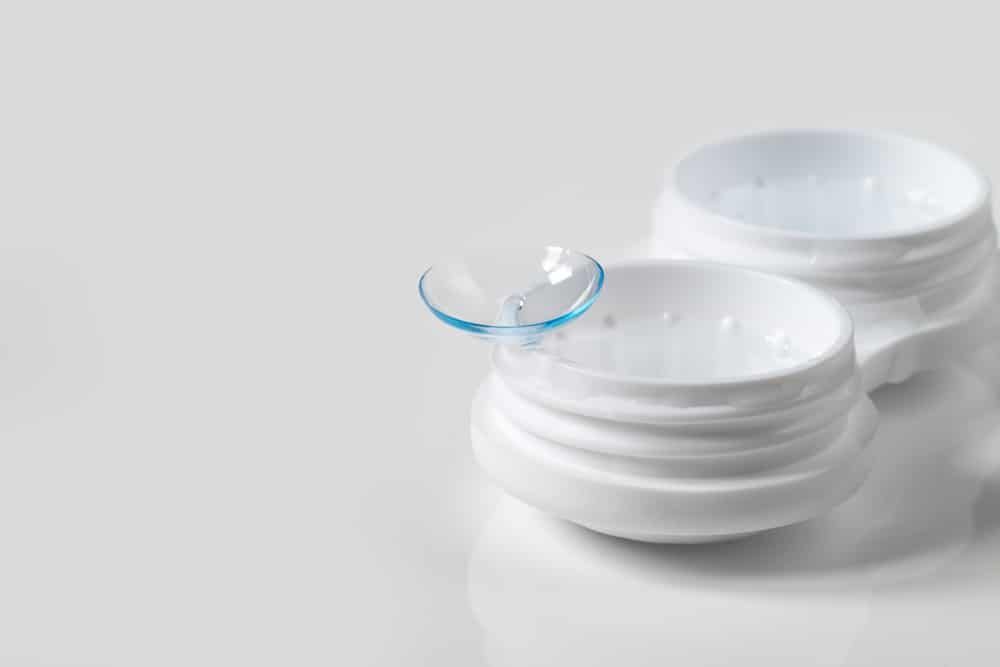 A Pair of Contact Lenses Sitting on Top of a White Container — Eyepower In Tahmoor, NSW