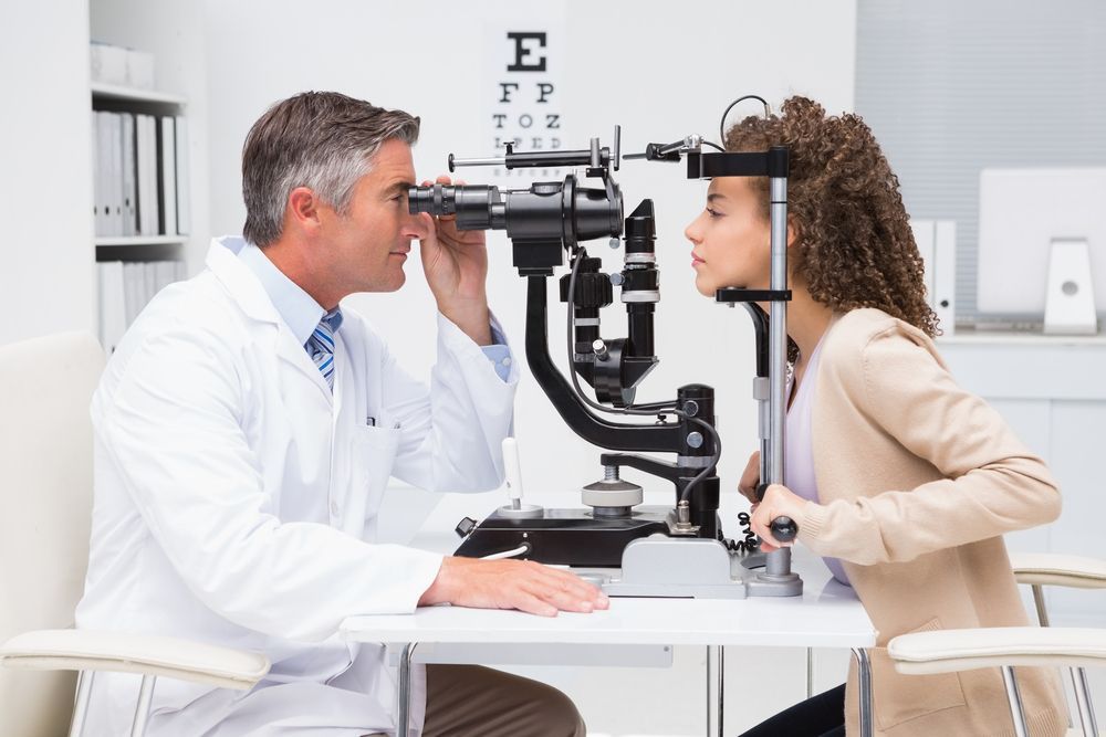 A Woman is Getting Her Eyes Examined by an Ophthalmologist — Eyepower In Tahmoor, NSW