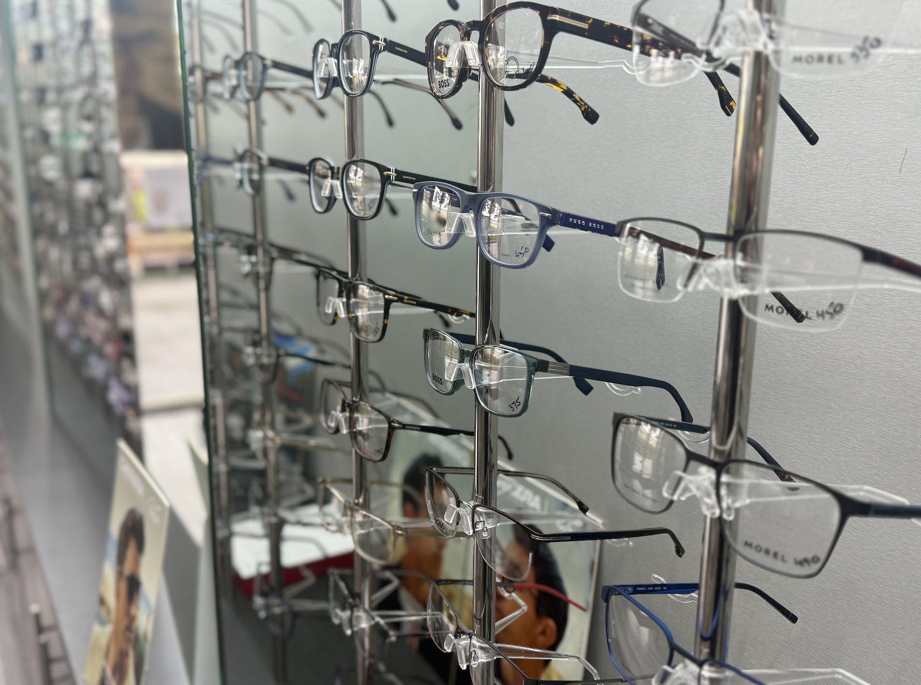 Display of eyeglasses on a rack, with various frames in different colours and styles — Eyepower In Wilton, NSW