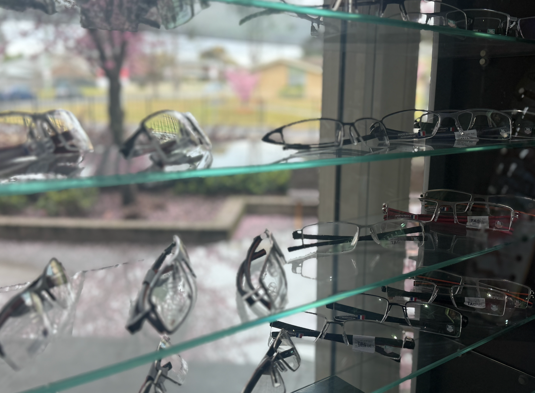 A Person is Holding Two Pairs of Glasses in Their Hands — Eyepower In Buxton, NSW