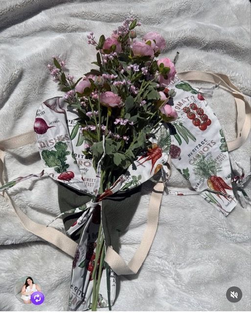 Fabric bouquet sleeve filled with flowers