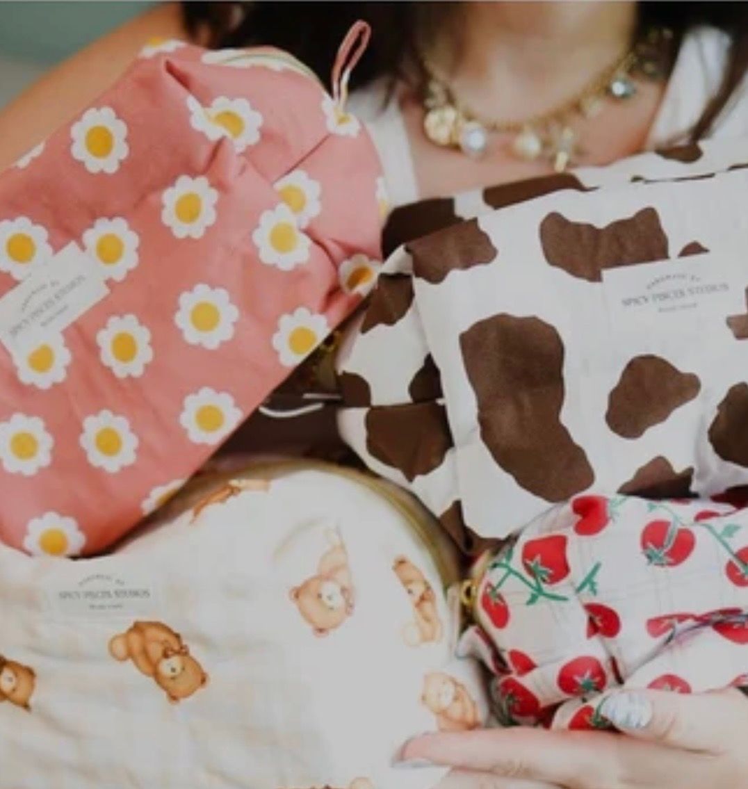 Handmade floral and cow print pouches