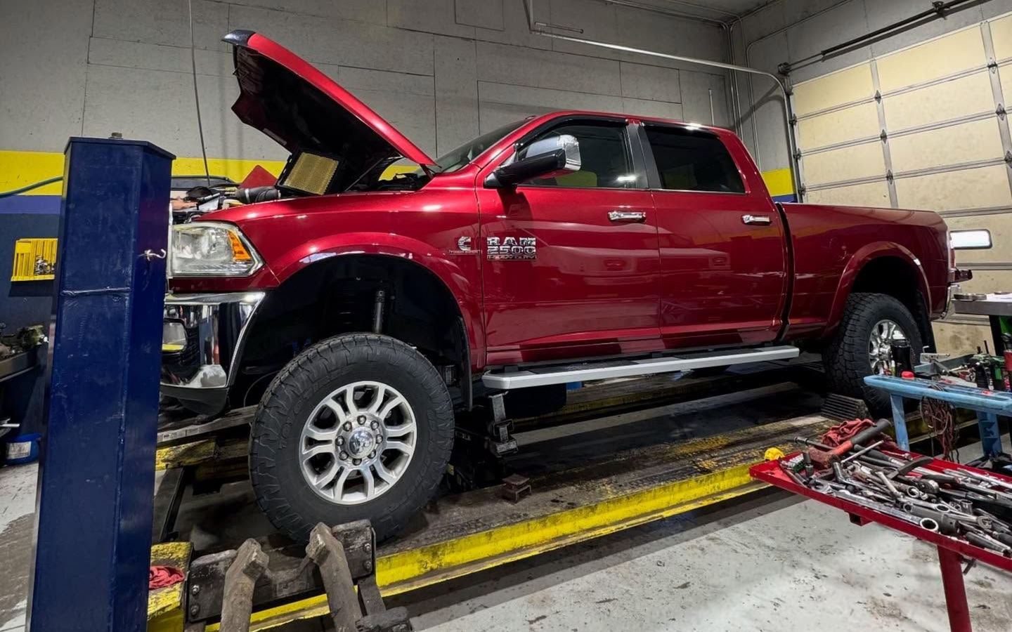 Red Pickup Truck In Diesel Repair Bay | Spooled Up Diesel Repair