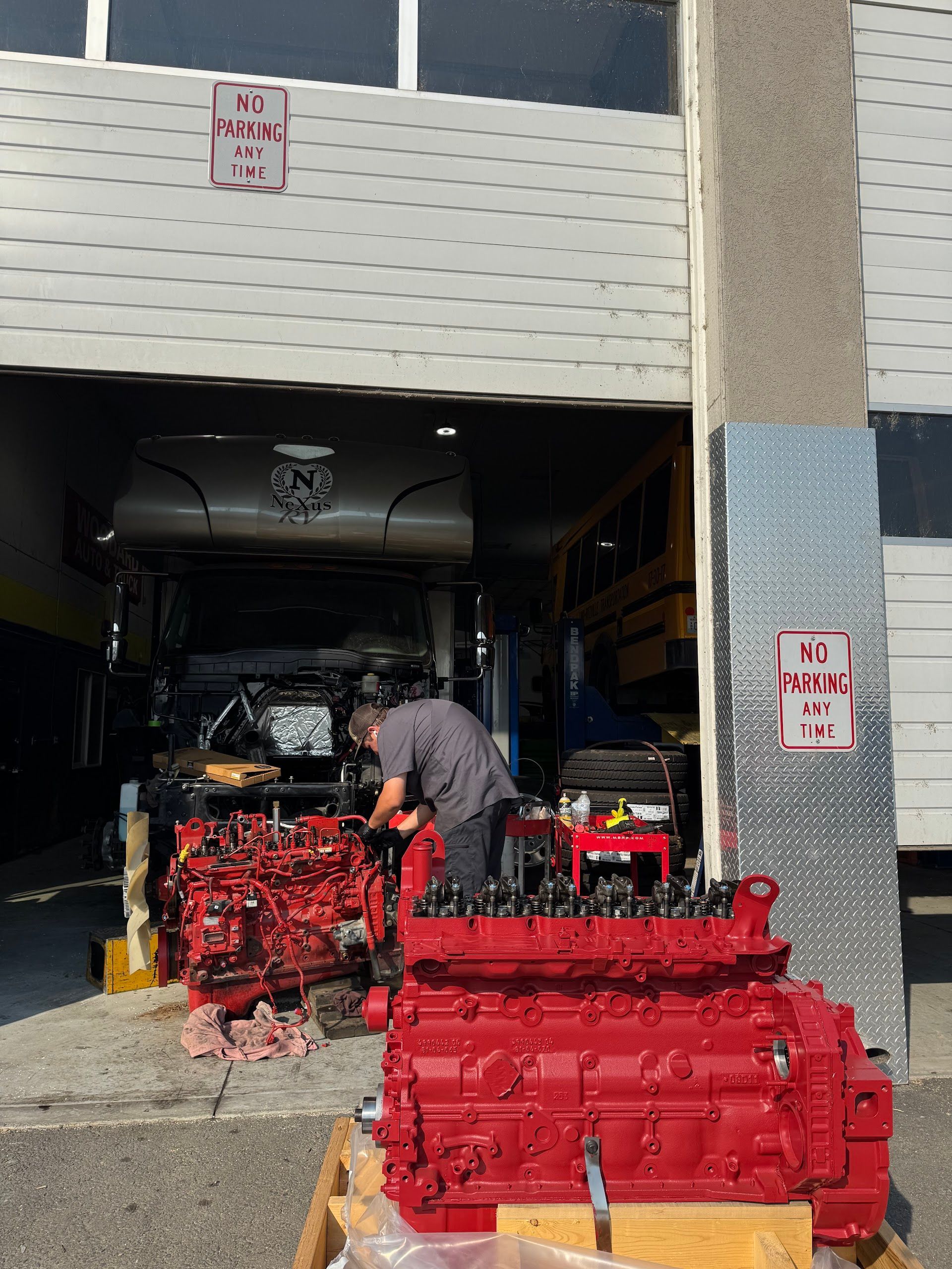 Red Diesel Engine Outside Repair Shop Entrance | Spooled Up Diesel Repair