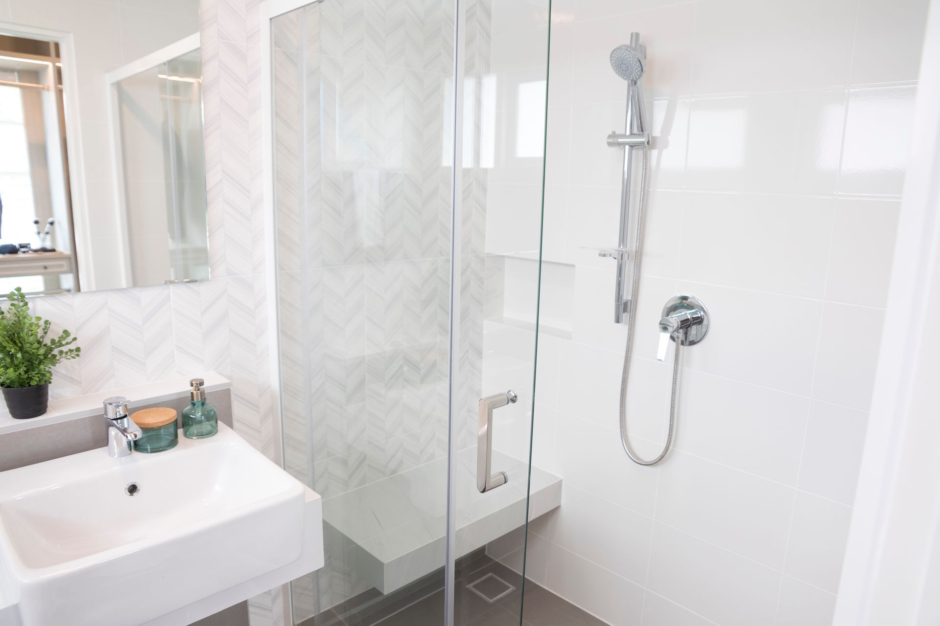 Modern bathroom featuring frameless transparent glass shower doors.