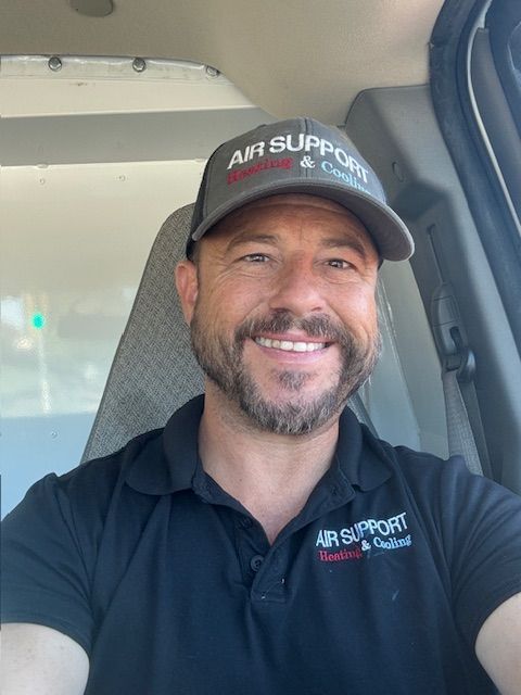 A man wearing a hat that says air support on it