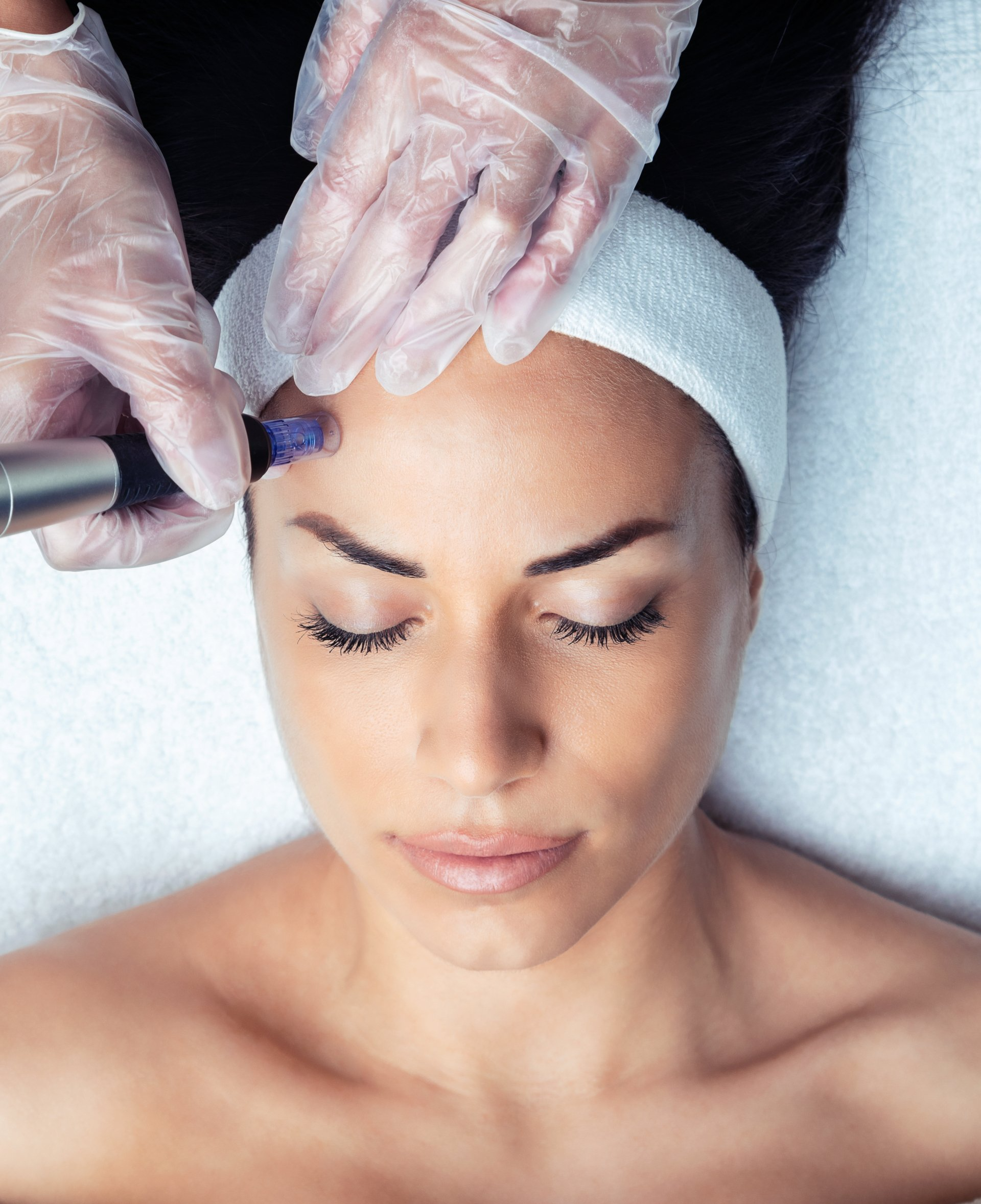 A woman is getting a facial treatment at a spa.