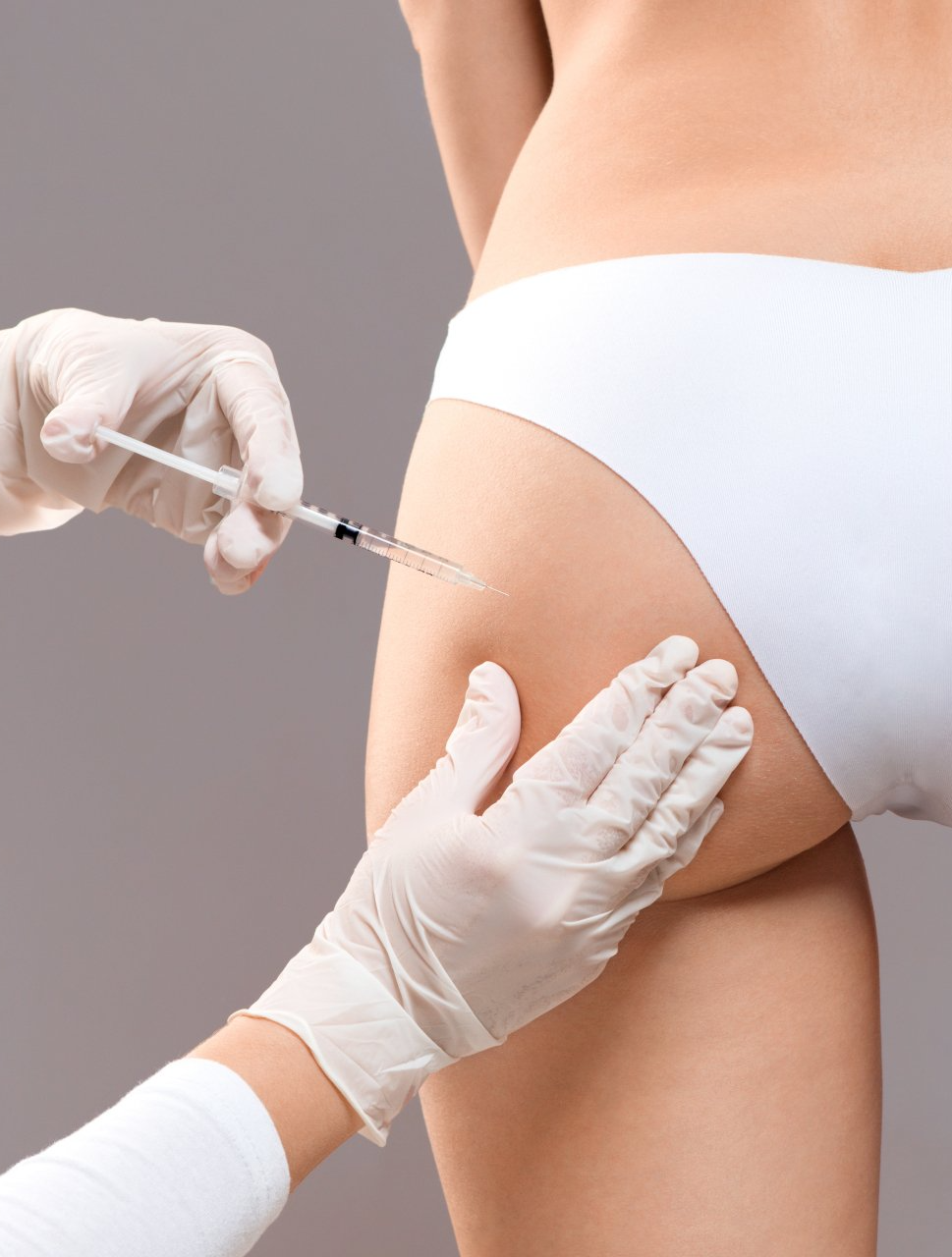 slim lady having but injection at beauty salon