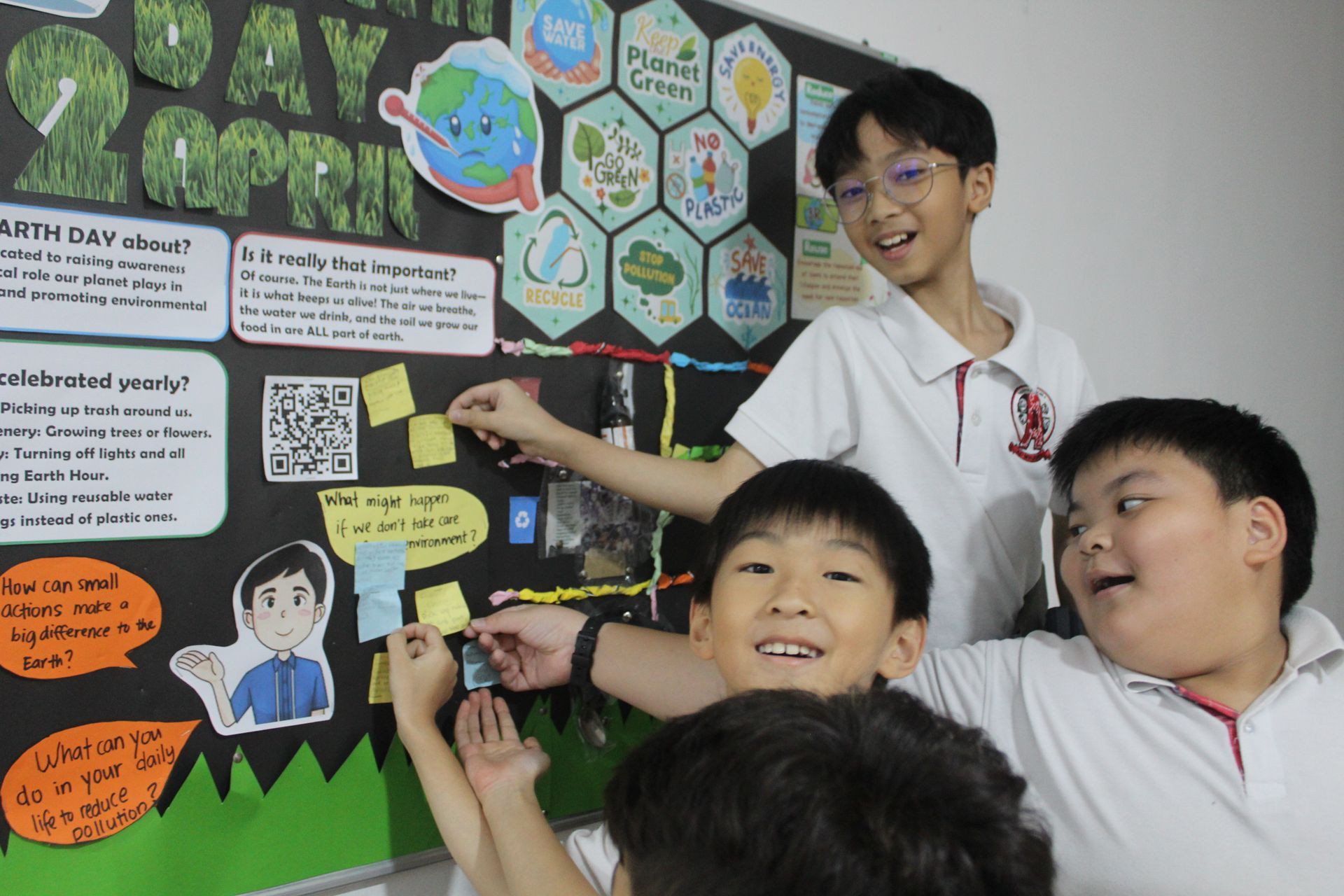 Students actively participating in an Earth Day environmental awareness activity.