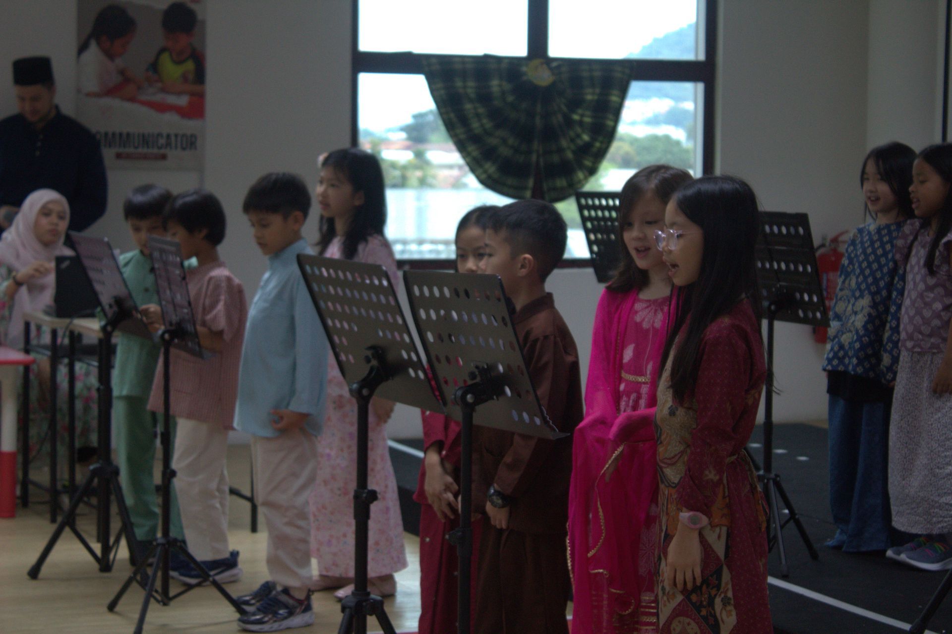 A group of primary school students participating in a musical performance.