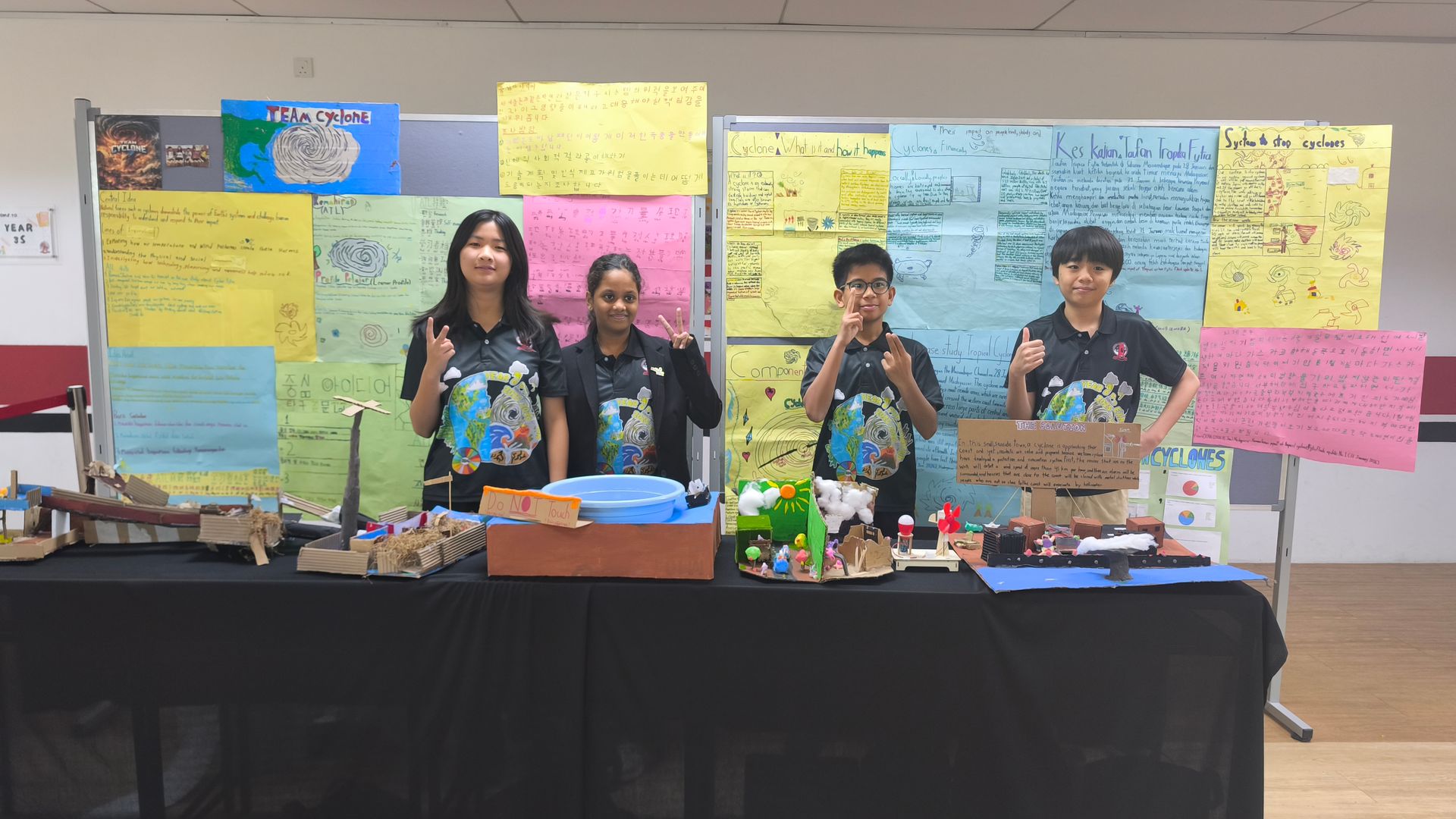 Students proudly presenting their cyclone-themed science and geography projects during the school’s Open Day.