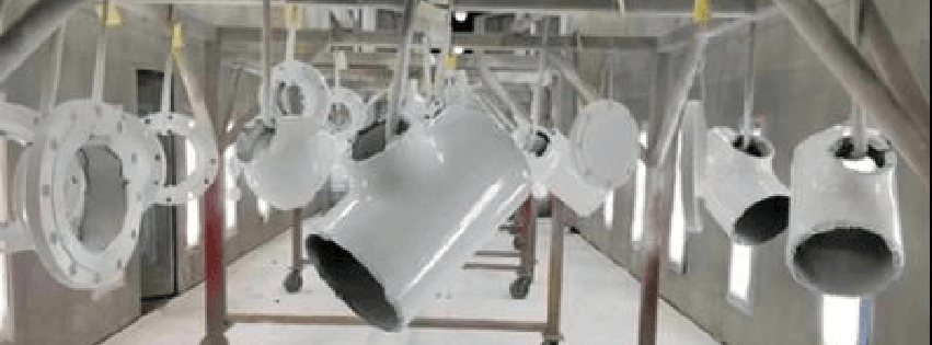 Hanging white industrial parts and rings in a paint booth or spray line