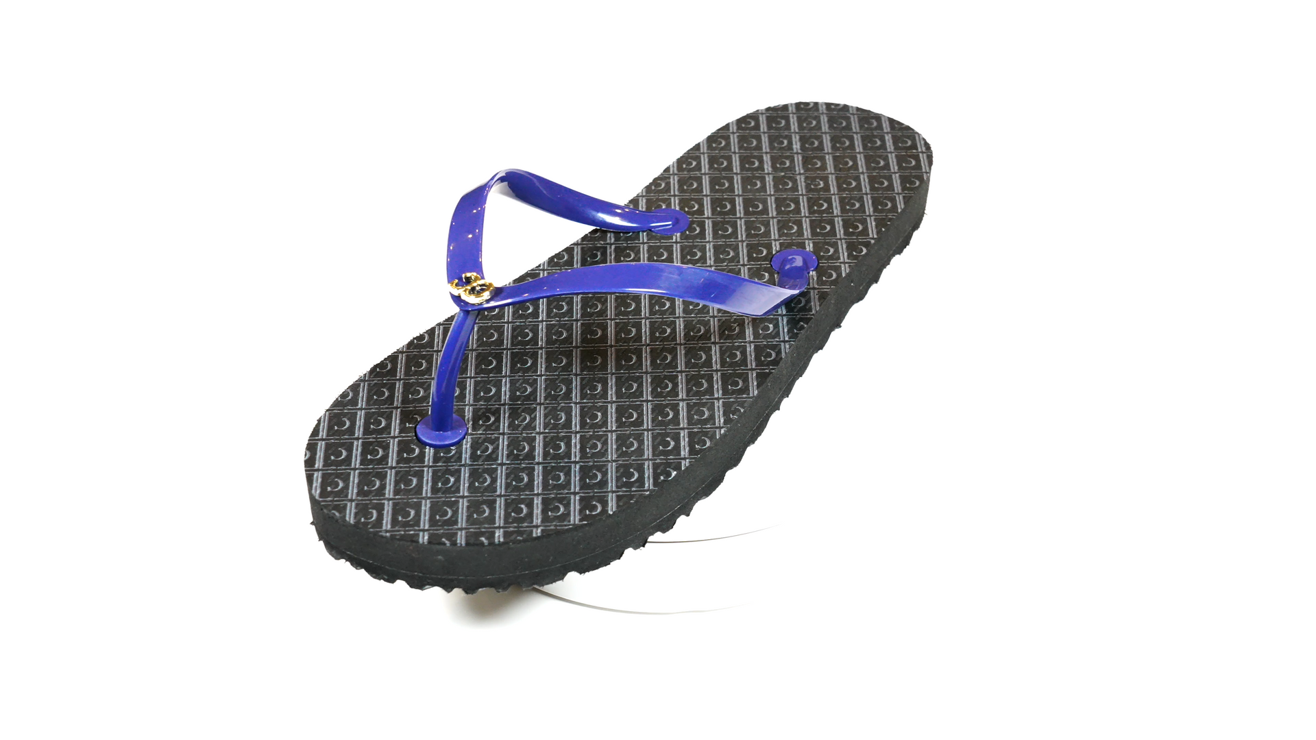 A pair of black flip flops with a blue strap on a white background.