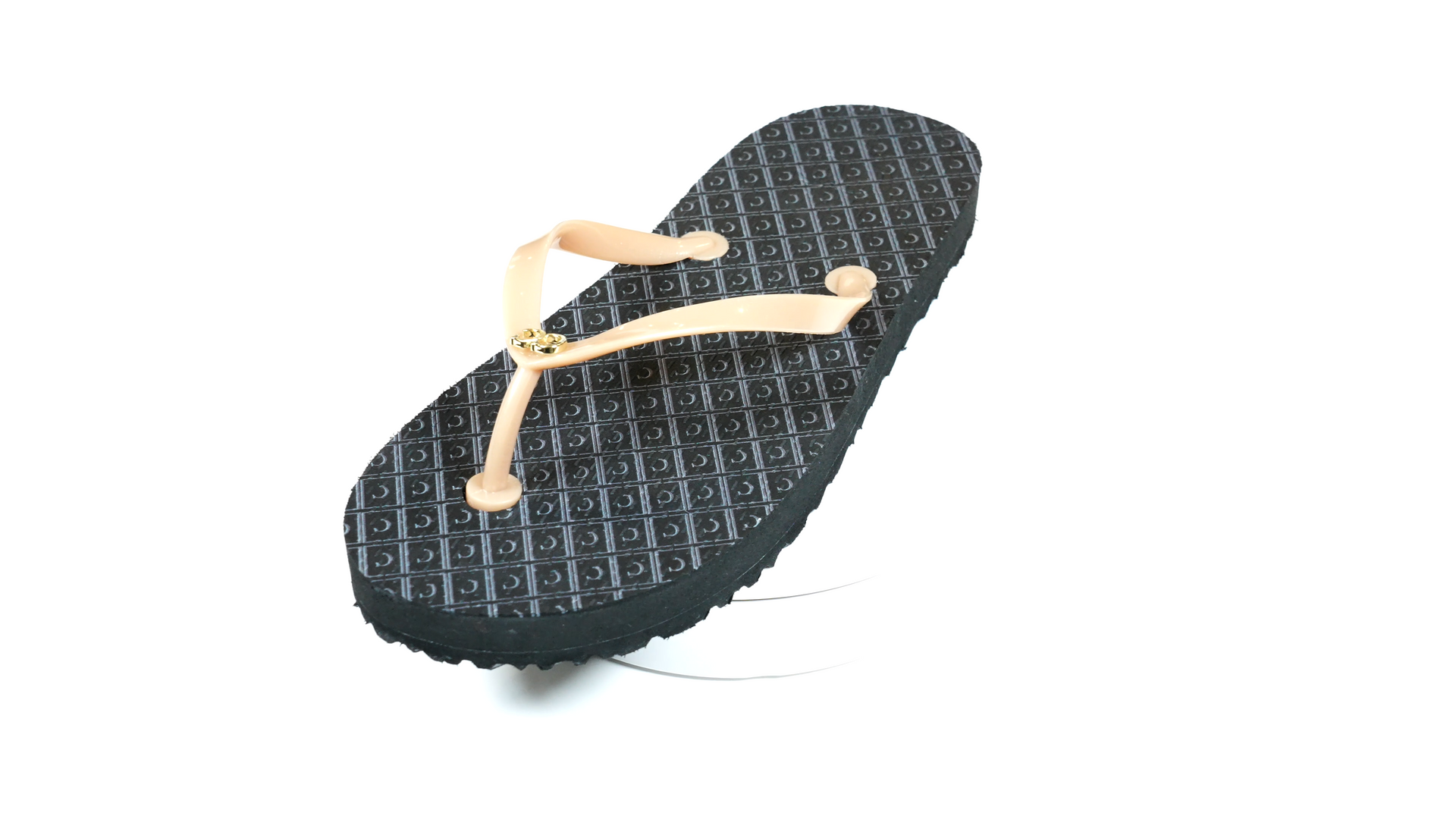 A pair of black flip flops with brown straps on a white background.