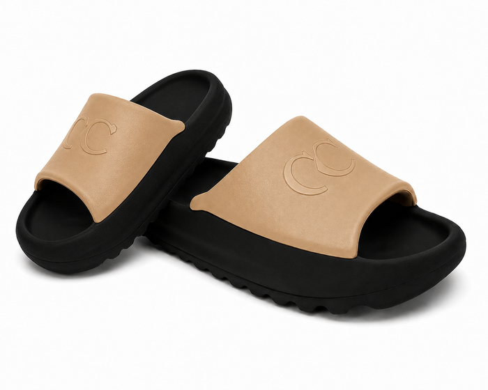 Pair of white flip-flops with turquoise straps on a light gray background