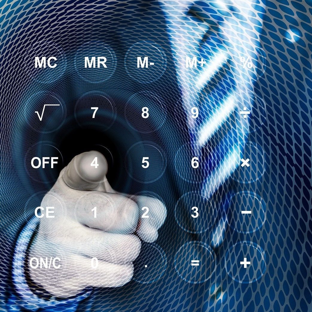 Businessman pointing at an image of a calculator