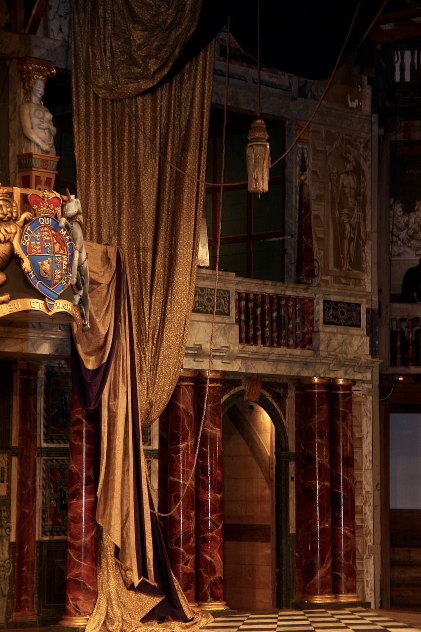 A curtain is hanging from the ceiling in a theatre.