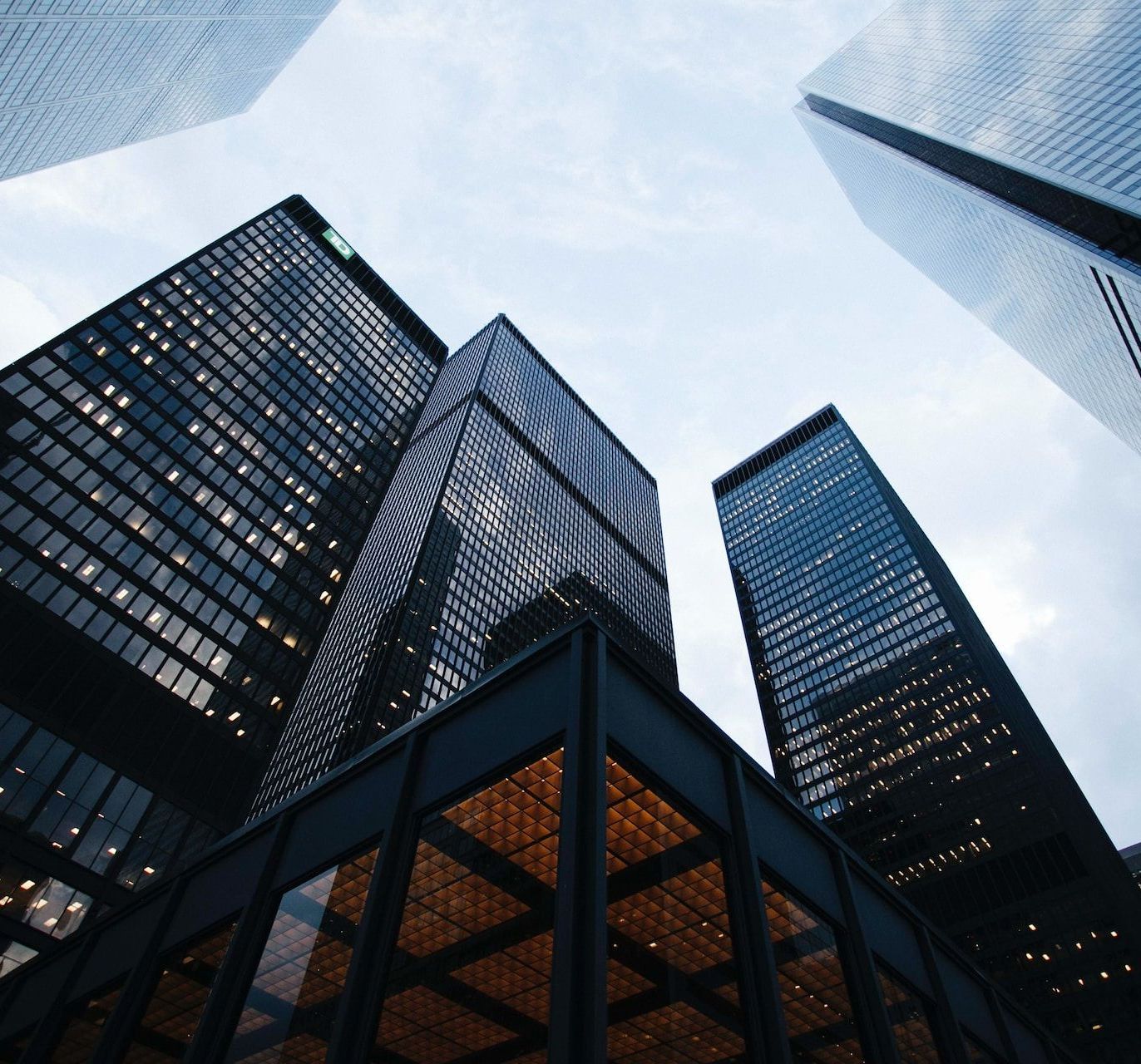 Looking up at a group of tall buildings