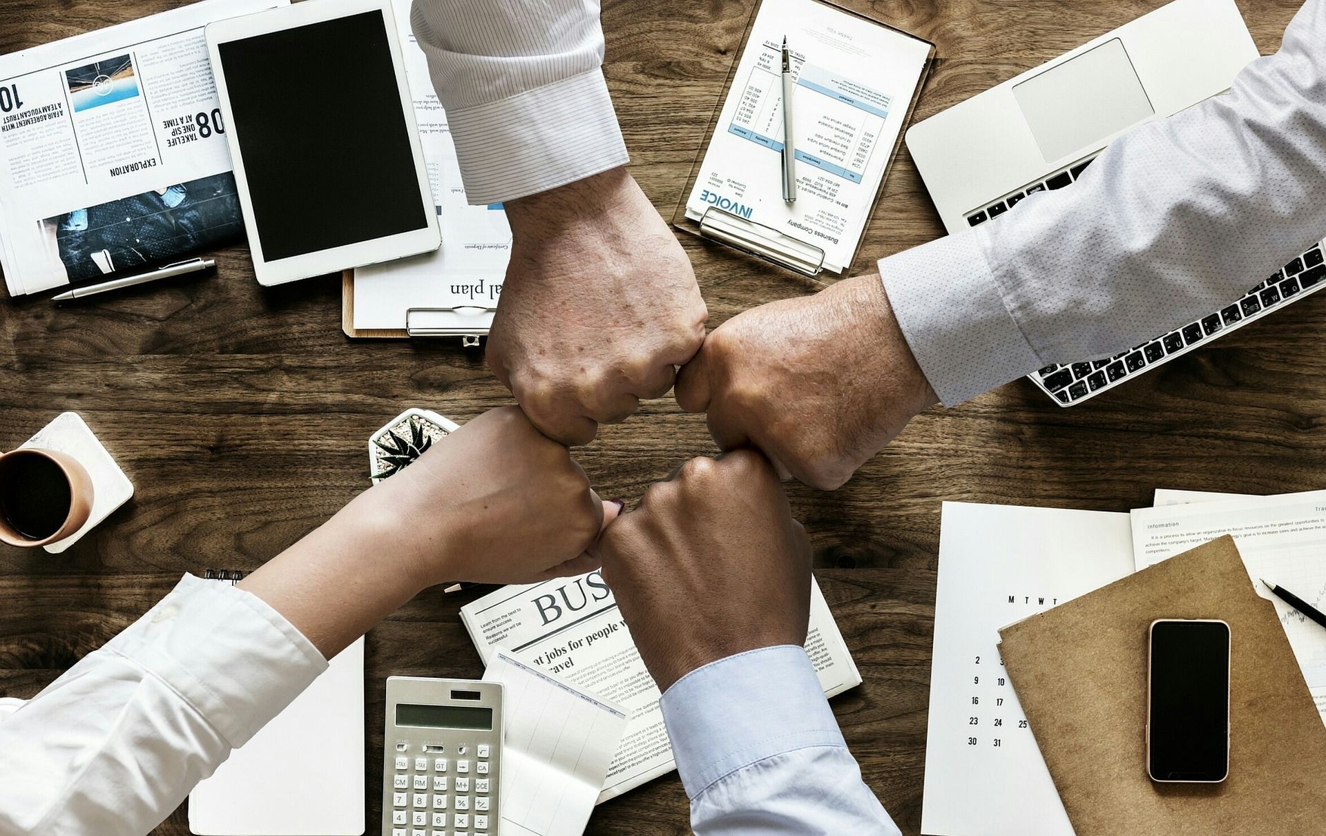 4 fists of team members