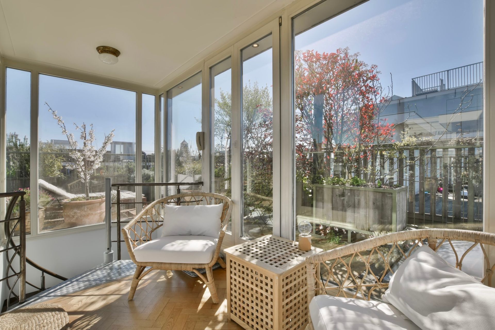a room with a lot of windows and a chair