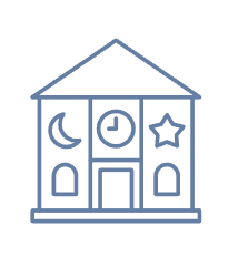 A building with a clock, moon, and star symbols on it, indicating a school.