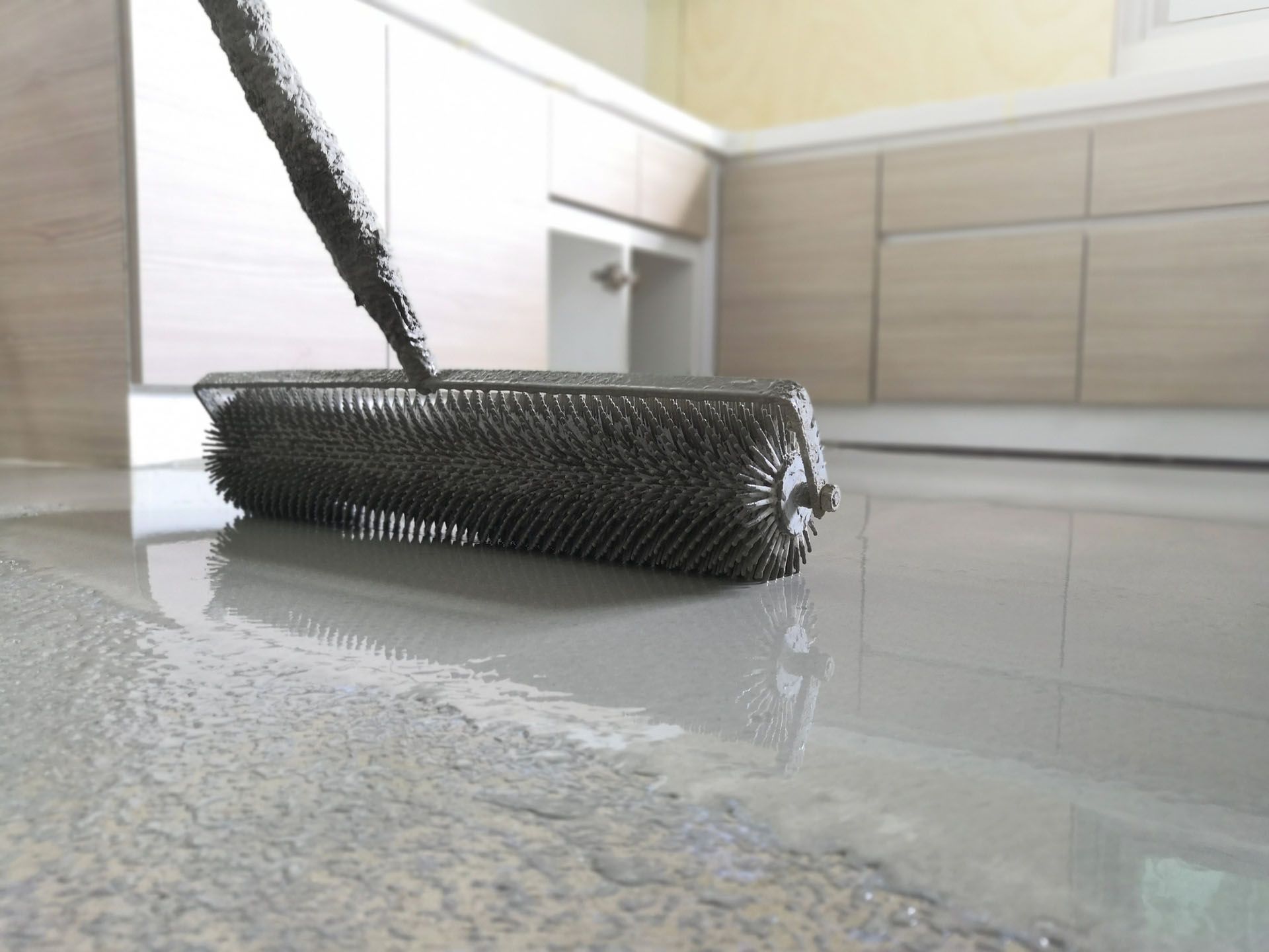 Needle Rolling Epoxy Floor — Lincoln, NE — M&D Concrete and Epoxy Flooring Inc.