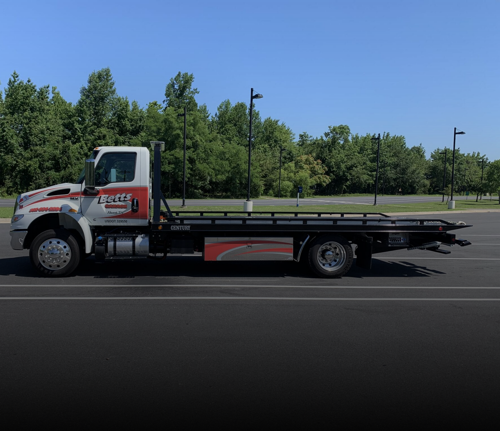 Betts Garage flatbed tow truck ready for vehicle transport