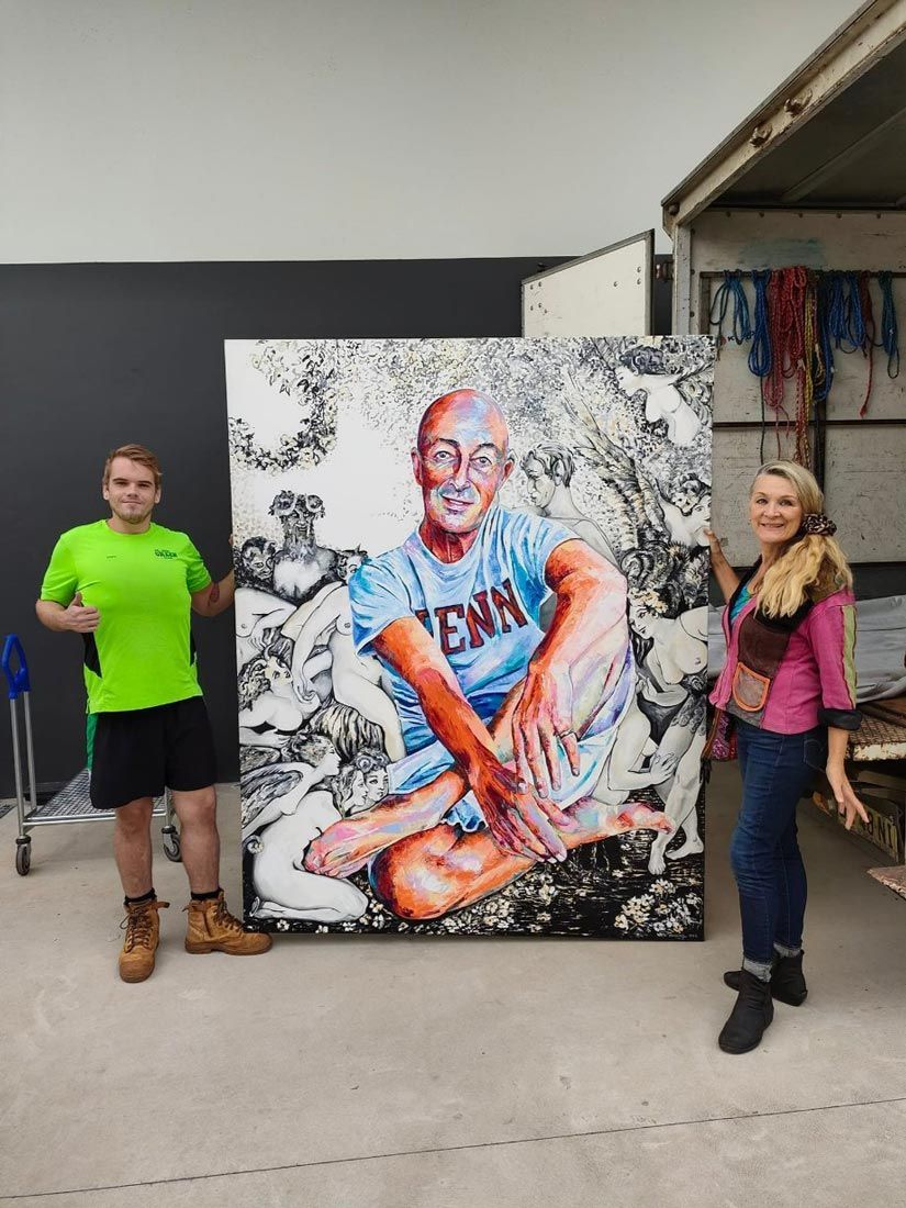 A Man and a Woman Are Standing Next to a Large Painting — Little Green Truck Port Macquarie in Crescent Head, NSW